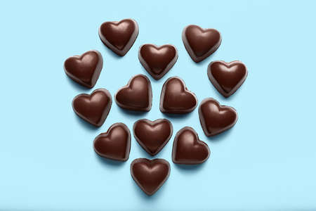 Tasty heart-shaped candies on blue backgroundの写真素材