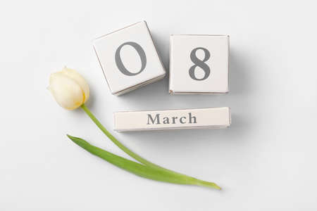 Calendar with date of International Women's Day and flower on white backgroundの写真素材