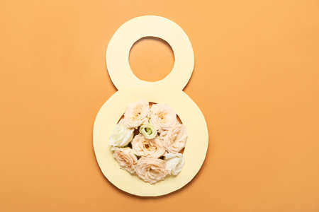 Greeting card for International Women's Day with flowers on color backgroundの写真素材