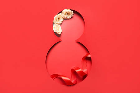 Greeting card for International Women's Day with flowers on red backgroundの写真素材