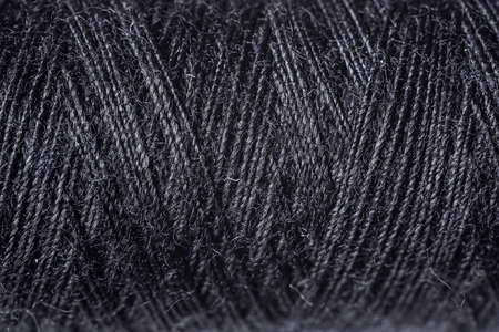 Black sewing threads as background