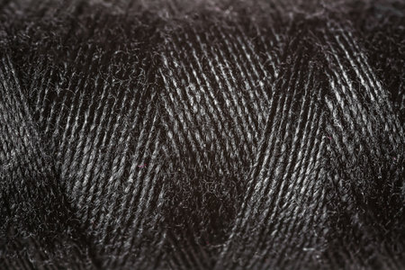 Black sewing threads as background
