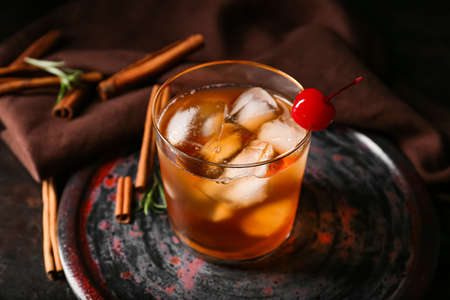 Glass of delicious Old Fashioned Cocktail on black backgroundの写真素材