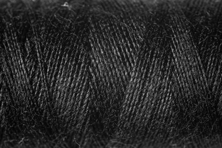 Black sewing threads as background