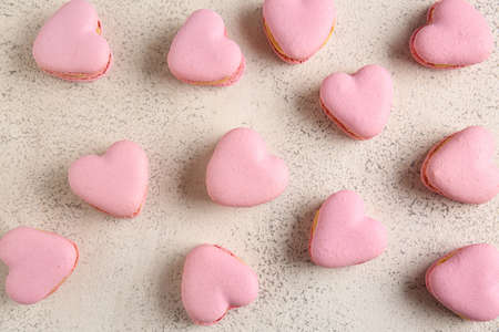 Tasty heart-shaped macaroons on light backgroundの写真素材