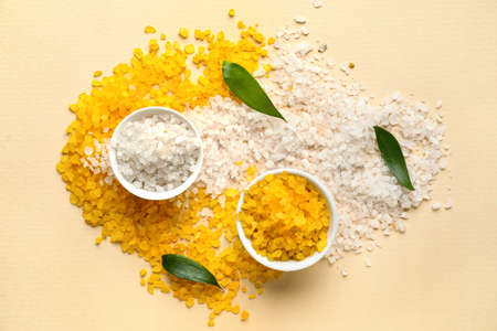 Composition with bowls of sea salt on color backgroundの写真素材