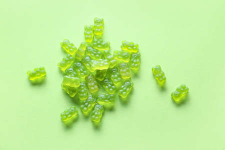 Sweet jelly bears on green backgroundの写真素材