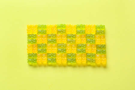 Yummy jelly bears on color background