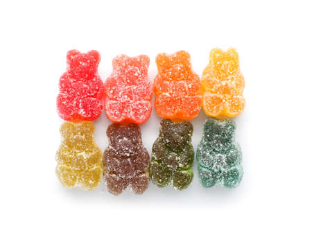 Multicolored jelly bears on white backgroundの写真素材