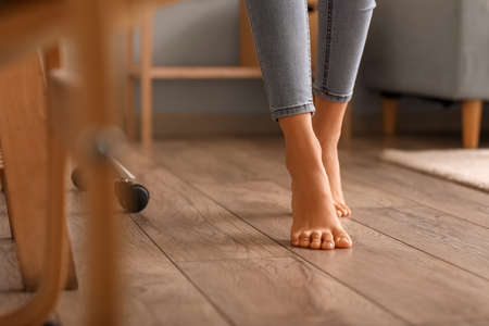 Bare feet of young woman at home, closeupの写真素材