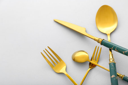 Stylish stainless steel cutlery on light background, closeupの写真素材