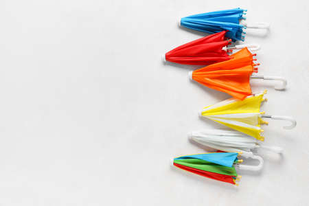 Many different umbrellas on light backgroundの写真素材