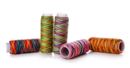 Sewing thread spools on white background