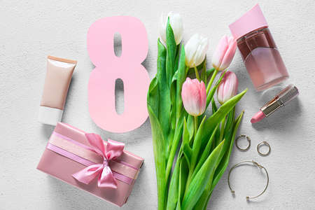 Beautiful tulip flowers, female accessories and gift box for International Women's Day on light...