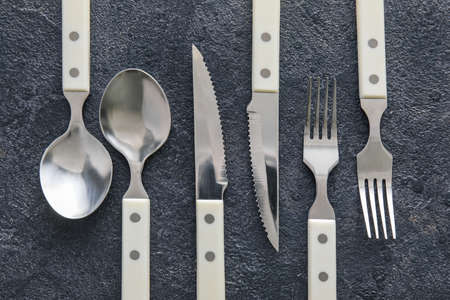 Elegant cutlery set on dark background