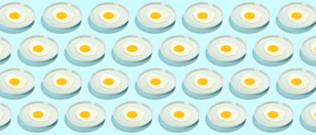 Many plates with fried eggs on light blue background. pattern for design