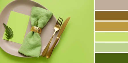 Beautiful table setting with floral decor on green background. different color patternsの写真素材