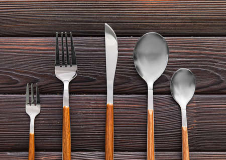 Elegant cutlery set on wooden backgroundの写真素材
