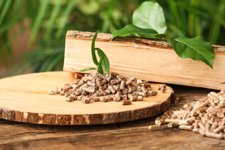 Pile of wood pellets on table outdoors