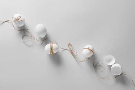 Composition with Easter eggs on light background