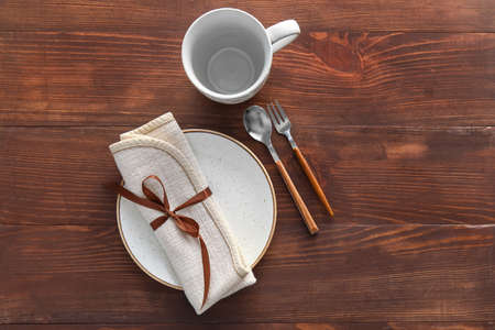 Elegant table setting on wooden background