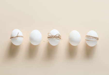 Composition with Easter eggs on beige background