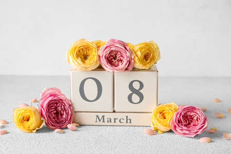 Cube calendar with date MARCH 8 and beautiful peony flowers for International Women's Day...
