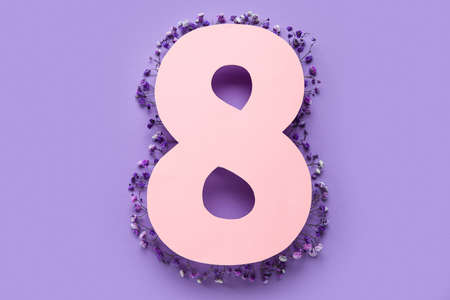Greeting card for International Women's Day celebration with paper number 8 and beautiful gypsophila...