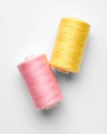 Different thread spools on white backgroundの写真素材