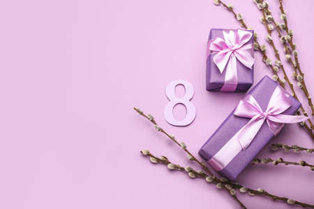 Greeting card for International Women's Day celebration with figure 8, gift boxes and willow...