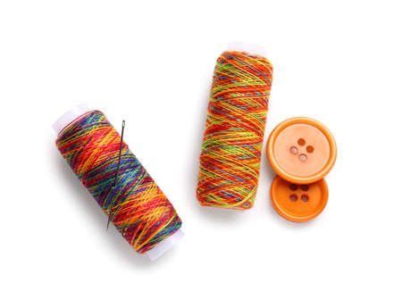 Thread spools with buttons on white background