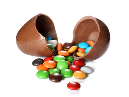 Chocolate Easter egg with candies isolated on white background