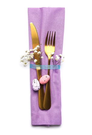 Stylish cutlery for Easter celebration on white background