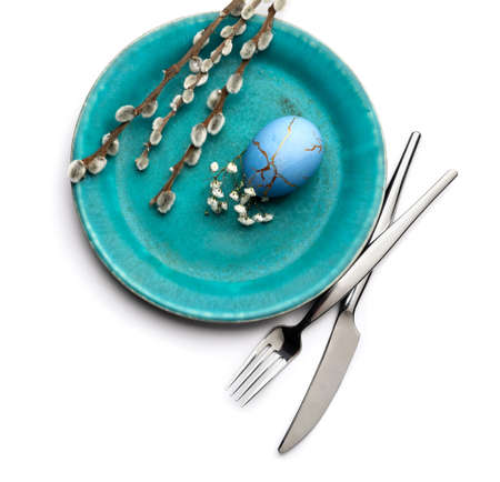 Stylish table setting for Easter celebration on white background