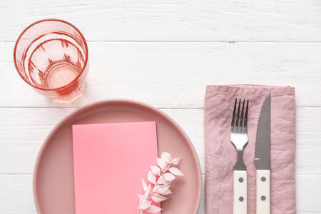 Simple table setting on light wooden backgroundの写真素材