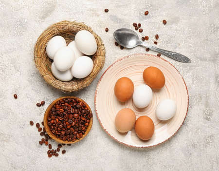 Easter eggs and coffee beans on grunge backgroundの写真素材