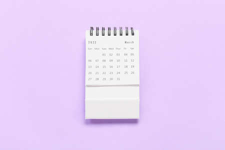 Paper calendar for March 2022 on lilac backgroundの写真素材