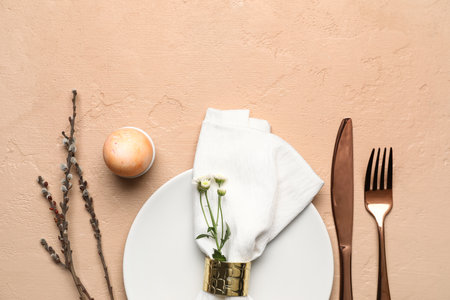 Stylish Easter table setting on beige backgroundの写真素材