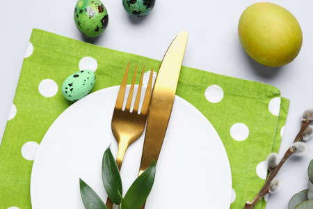 Stylish Easter table setting on light backgroundの写真素材