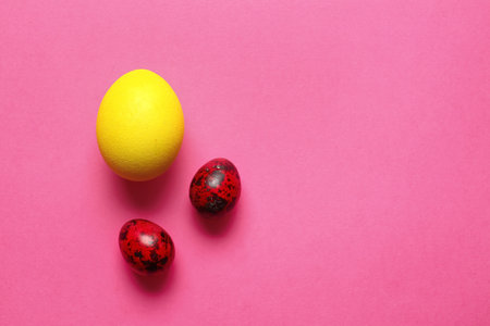 Different painted Easter eggs on color backgroundの写真素材