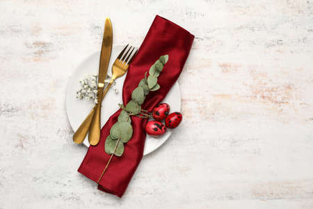 Stylish Easter table setting on light background