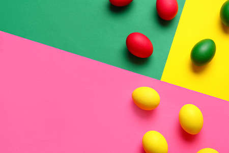 Multicolored Easter eggs on color backgroundの写真素材
