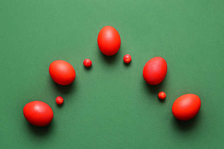 red painted easter eggs on color background