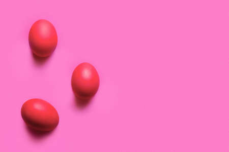 red painted easter eggs on color backgroundの写真素材