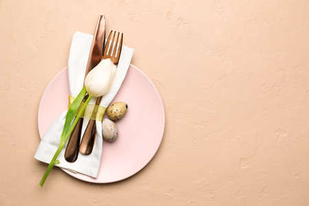 Stylish Easter table setting on beige backgroundの写真素材