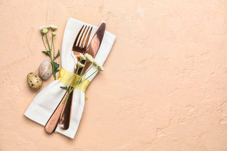 Stylish Easter table setting on beige background
