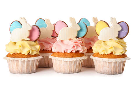 Yummy Easter cupcakes on white background