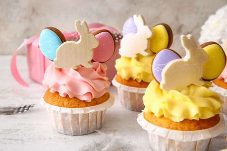Tasty Easter cupcakes on light background, closeupの写真素材