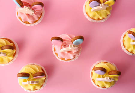 Tasty Easter cupcakes on pink backgroundの写真素材