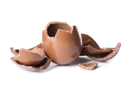 Broken chocolate Easter eggs isolated on white background
